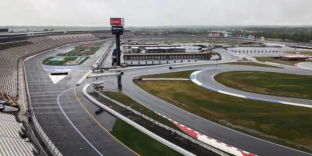 Charlotte Motor Speedway is shown in Concord, N.C., Wednesday, May 20, 2020. Some fans have been coming to the Coca-Cola 600 for decades, but they won’t be allowed into Charlotte Motor Speedwaý on Sunday due to Covid-19, leaving the grandstands empty and many disappointed. (AP Photo/Steve Reed)