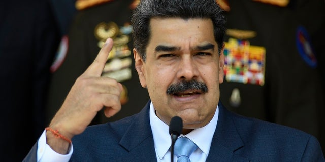 Venezuelan President Nicolas Maduro gives a press conference at the Miraflores presidential palace in Caracas, Venezuela.