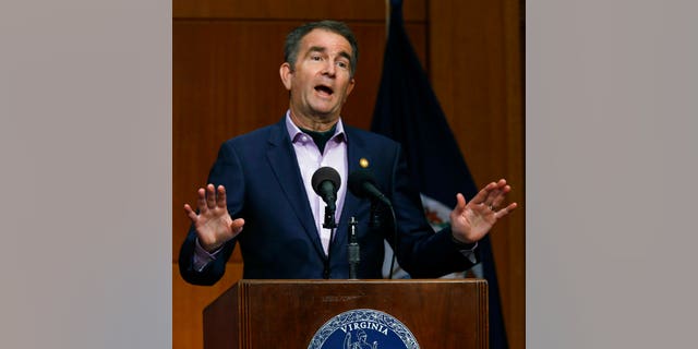 Virginia Governor Ralph Northam gives updates on the Coronavirus during his press briefing inside the Patrick Henry Building in Richmond, Va., Monday, April 27, 2020. (Bob Brown/Richmond Times-Dispatch via AP)