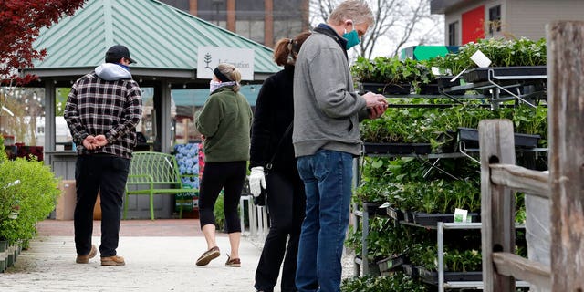 People shop at Lurvey Garden Center & Landscape Suppy store in Des Plaines, Ill., Thursday, April 30, 2020. Illinois garden centers and nurseries will reopen Friday, May 1, 2020 by Governor J.B. Pritzker. Lurvey Home and Garden opened its nursery yard and store on Monday, April 27, 2020.