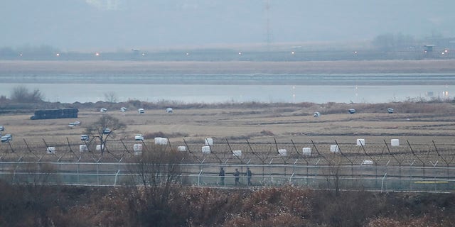 <br> South Korean army soldiers patrol along the barbed-wire fence in Paju, South Korea, near the border with North Korea, Dec. 16, 2019. (Associated Press)