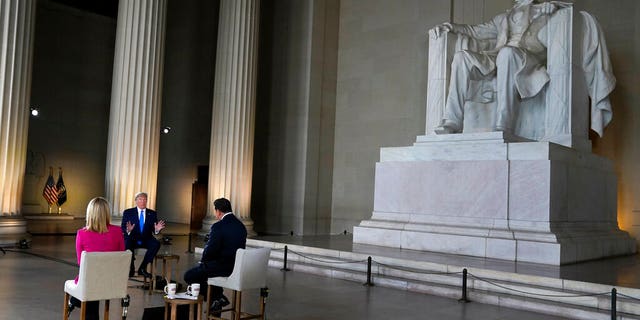 President Donald Trump speaks during a Fox News virtual town hall from the Lincoln Memorial, Sunday, May 3, 2020, in Washington, co-moderated by FOX News anchors Bret Baier and Martha MacCallum. (AP Photo/Evan Vucci)