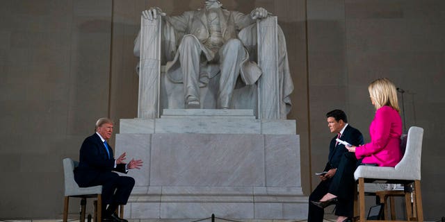 President Donald Trump speaks during a Fox News virtual town hall from the Lincoln Memorial, Sunday, May 3, 2020, in Washington. (AP Photo/Evan Vucci)