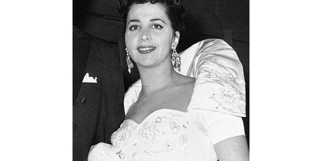 FILE - This Oct. 26, 1959 file photo shows American mezzo-soprano Rosalind Elias arriving at the Metropolitan Opera House in New York to attend a performance of Verdi's 'Il Trovatore.' Elias, who created roles in a pair of Samuel Barber world premieres and made her Broadway debut at age 81, died Sunday May 3, 2020. She was 90. (AP Photo/Ray Howard, File)