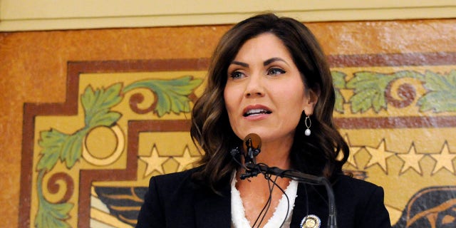 FILE - In this Jan. 8, 2019 file photo, South Dakota Gov. Kristi Noem gives her first State of the State address in Pierre, S.D. While many other governor’s have broken from President Donald Trump on stay-at-home orders to curb the spread of coronavirus or when to restart economic activity, Noem has tracked close to the president. (AP Photo/James Nord, File)