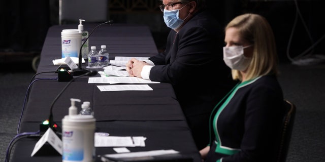Brian Miller and Dana Wade at the hearing of the Senate Banking, Housing, and Urban Affairs Committee Tuesday on Capitol Hill.