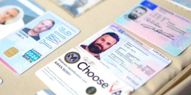 This photo released by the Venezuelan Miraflores presidential press office shows what Venezuelan authorities identify as the the I.D. cards of former U.S. special forces citizen Airan Berry, right, and Luke Denman, left, in Caracas, Venezuela, Monday, May 4, 2020.