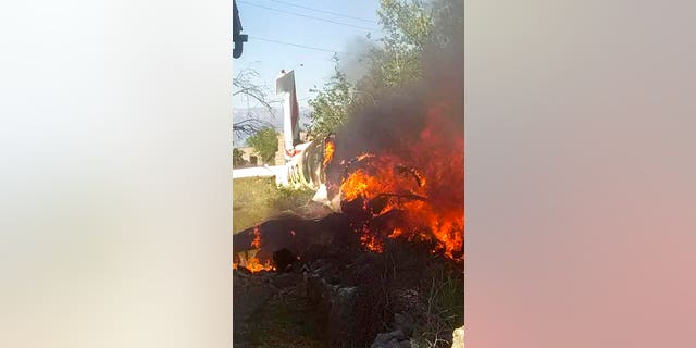 A Croatian air force plane burns after crashing in Biljane, Croatia, Thursday, May 7, 2020. Croatia’s Defense Ministry says an air force training plane crashed and two crew members were killed during a routine training flight Thursday afternoon. (Diadora TV via AP)