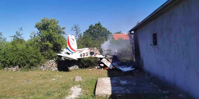 A Croatian air force plane burns after crashing in Biljane, Croatia, Thursday, May 7, 2020. (Diadora TV via AP)