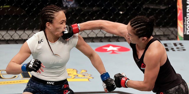 Carla Esparza, right, lands a punch on Michelle Waterson during a UFC 249 mixed martial arts bout, Saturday, May 9, 2020, in Jacksonville, Fla. (Associated Press)