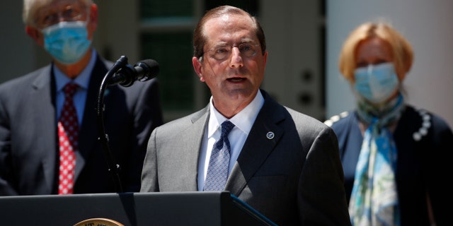 Department of Health and Human Services Secretary Alex Azar speaks about the coronavirus in the Rose Garden of the White House, Friday in Washington. (AP Photo/Alex Brandon)