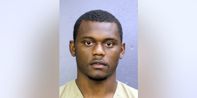 This booking photo provided by the Broward County, Fla., Sheriff's Office shows DeAndre Baker. Baker is charged with four counts of armed robbery with a firearm and four counts of aggravated assault with a firearm. He turned himself in at the Broward County Jail. (Broward County Sheriff's Office via AP)