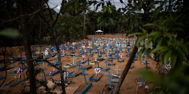 Graves for people who have died in the past month fill a new section of the Nossa Senhora Aparecida cemetery, amid the new coronavirus pandemic, in Manaus, Brazil. (AP Photo/Felipe Dana)