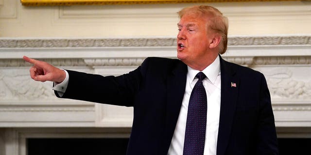 Melania Trump President Donald Trump gestures as he leaves after a meeting with restaurant industry executives about the coronavirus response, in the State Dining Room of the White House, Monday, May 18, 2020, in Washington. (AP Photo/Evan Vucci)