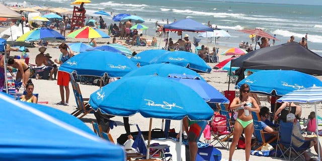 Cocoa Beach, Fla., packed with Memorial Day beachgoers on Saturday. (Stephen M. Dowell/Orlando Sentinel via AP)
