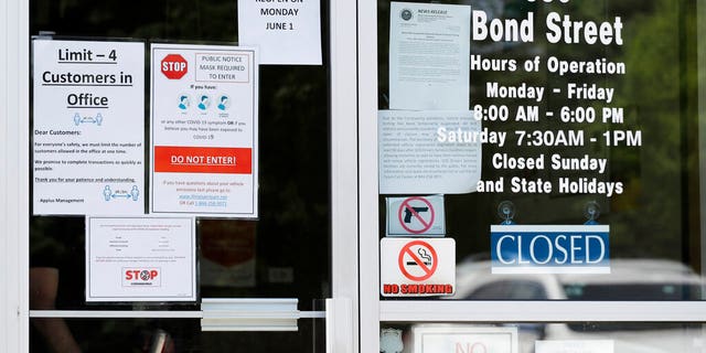 Information signs are displayed at an Illinois Air Team Test Station in Lincolnshire, Ill., Wednesday, May 27, 2020.
