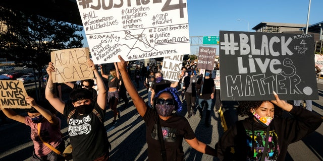 Demonstrators shut down the Hollywood Freeway in Los Angeles on Wednesday, May 27, 2020, during a protest about the death of George Floyd in police custody in Minneapolis earlier in the week. (Associated Press)