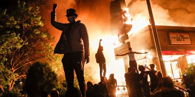 Trump blasts Minneapolis mayor, vows military support if needed 2 Protestors demonstrate outside of a burning fast food restaurant, Friday, May 29, 2020, in Minneapolis. Protests over the death of George Floyd, a black man who died in police custody Monday, broke out in Minneapolis for a third straight night. (AP Photo/John Minchillo)