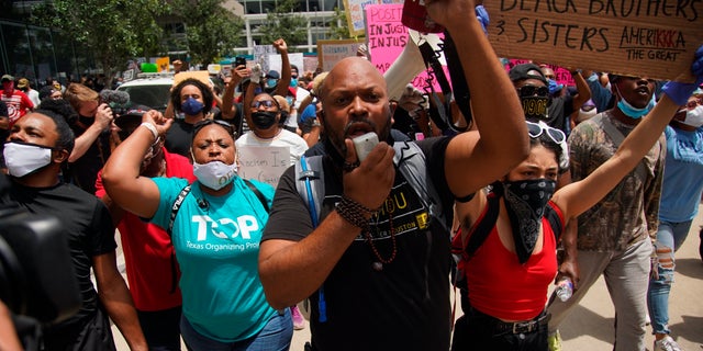 Black Lives Matter protesters rally in honor of George Floyd at Discovery Green in Houston, Friday, May 29, 2020. Floyd died Memorial Day while in the custody of the Minneapolis police. (Elizabeth Conley/Houston Chronicle via AP)