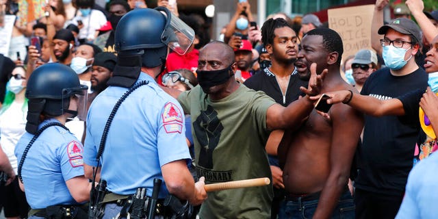 Demonstrators standing off with police in downtown Raleigh, N.C., on Saturday, during a protest over the death of George Floyd, who died in police custody on Memorial Day in Minneapolis. (Ethan Hyman/The News & Observer via AP)