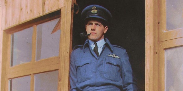 A colorized version of a photo of Alastair Gunn relaxing in the dispersal doorway at RAF Benson in late summer 1941.