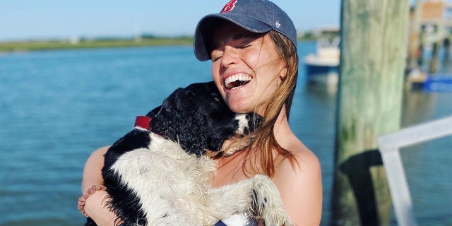 Jane Chiavelli and her dog, Gus, who she fostered before adopting during COVID-19 pandemic.<br>
