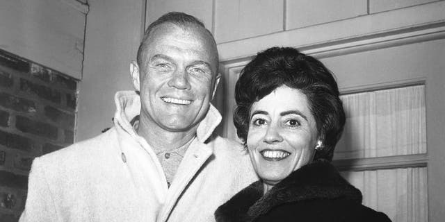 In this Feb. 3, 1962 file photo, astronaut John Glenn poses with his wife, Annie, outside their Arlington, Va., home during his first news conference.  (AP Photo/Bob Schutz, File)