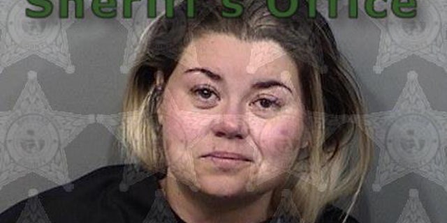 Police arrested Audra Adams, 32, on charges of trespassing, disorderly conduct, resisting an officer and misusing the 911 system.