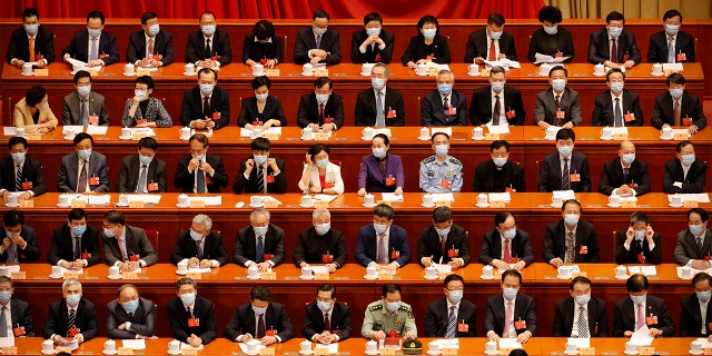 Delegates wear face masks for the opening session of the Chinese People's Political Consultative Conference at the Great Hall of the People in Beijing, May 21, 2020.
