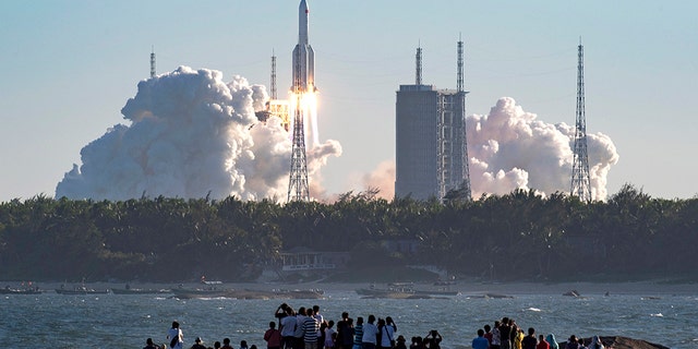 In this photo released by Xinhua News Agency, China's new large carrier rocket Long March-5B blasts off from the Wenchang Space Launch Center in southern China's Hainan Province, May 5, 2020. Pieces of its upper stage later crashed down in West Africa.