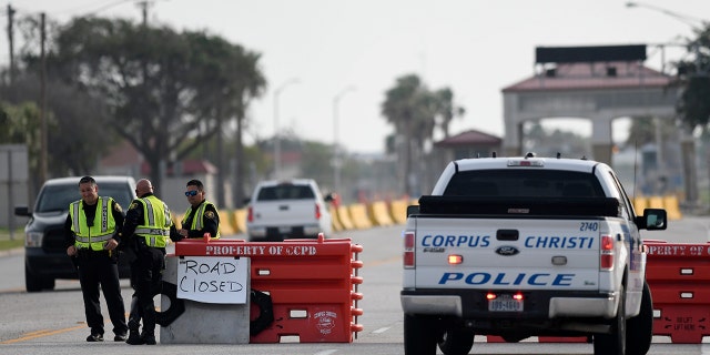 Police officers stand at a checkpoint after a shooting incident at Naval Air Station Corpus Christi, Texas, U.S. May 21, 2020.