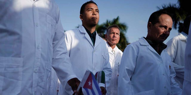 Cuban doctors take part in a farewell ceremony before departing to Italy to assist, amid concerns about the spread of the coronavirus disease (COVID-19) outbreak, in Havana, Cuba.