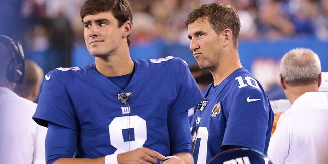 New York Giants quarterback Daniel Jones (8) looks on with quarterback Eli Manning (10) during the second half against the Chicago Bears at MetLife Stadium Aug 16, 2019.