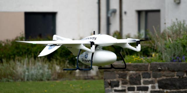 Skyports delivery drone manufactured by Wingcopter in-flight. Supplies are transported in the container beneath the drone - file photo.