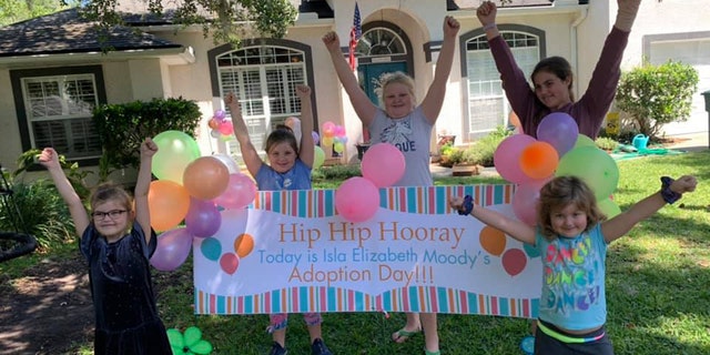 Well-wishers on Isla Moody's adoption day.
