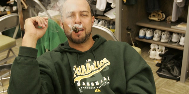 OAKLAND, CA - APRIL 14: Esteban Loaiza of the Oakland Athletics smokes a cigar in the clubhouse before the game against the New York Yankees at the McAfee Coliseum in Oakland, California on April 14, 2007. (Photo by Michael Zagaris/MLB Photos via Getty Images)