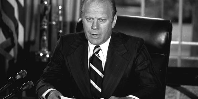 U.S. President Gerald Ford tells newsmen, Sunday, September 8, 1974, in his White House office that he has granted former President Richard M. Nixon "a full, free and absolute pardon" for all "offenses against the United States" during the period of his presidency. Ford then signed the document. (AP Photo)