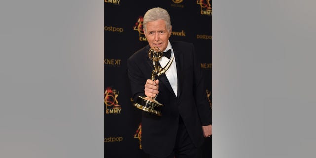 Alex Trebek poses with the Daytime Emmy Award for Outstanding Game Show Host in the press room during the 46th annual Daytime Emmy Awards at Pasadena Civic Center on May 5, 2019 in California.