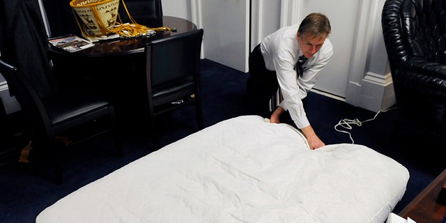 Rep. Paul Gosar, R-Ariz.. fills up an air mattress at his office in the Cannon building in Washington in 2011. (Photo by Matt McClain/The Washington Post via Getty Images)