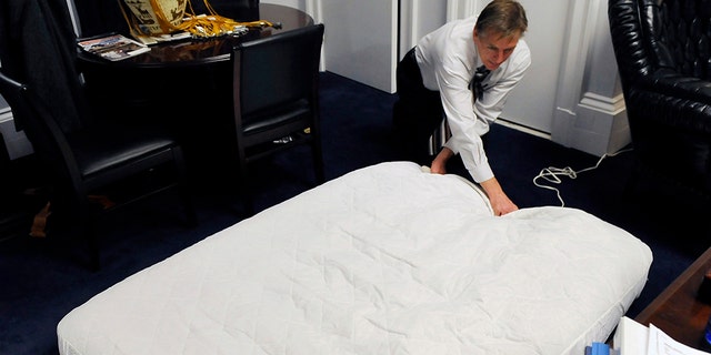 Rep. Paul Gosar, R-Ariz.. fills up an air mattress at his office in the Cannon building in Washington in 2011. (Photo by Matt McClain/The Washington Post via Getty Images)