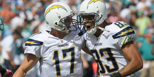San Diego Chargers quarterback Philip Rivers #17 and wide receiver Vincent Jackson #83 celebrate after hooking up on a 55 yard touchdown pass in the first quarter against the Miami Dolphins at Qualcomm Stadium on September 25, 2011 in San Diego, California.