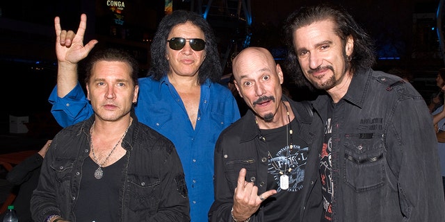 From left, Eric Singer, Gene Simmons, Bob Kulick, and Bruce Kulick backstage at KISS Army Night and jam session at Rocktoberfest at L.A. LIVE on October 18, 2012 in Los Angeles, Calif. 