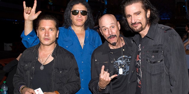 From left, Eric Singer, Gene Simmons, Bob Kulick, and Bruce Kulick backstage at KISS Army Night and jam session at Rocktoberfest at L.A. LIVE on October 18, 2012 in Los Angeles, Calif.