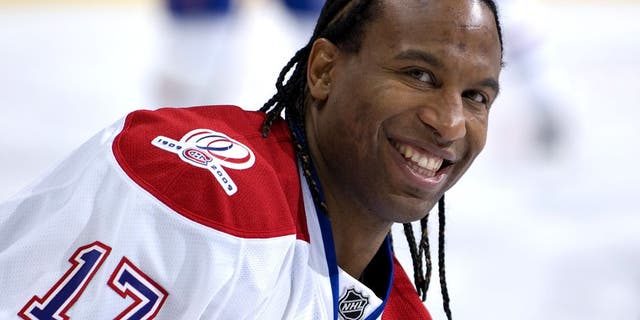 Georges Laraque #17 of the Montreal Canadiens laughs with former teammates before a game against the Edmonton Oilers on October 10, 2009, at Rexall Place in Edmonton, Alberta, Canada. The Oilers beat the Canadiens 3-2. (Photo by Andy Devlin/NHLI via Getty Images)