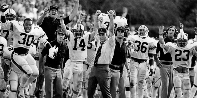 Head coach Pat Dye and the Auburn Tigers celebrate on the sidelines during a game in 1982. (Photo by Collegiate Images via Getty Images)