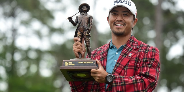 Satoshi Kodaira of Japan poses with the trophy after winning on the third playoff hole during the final round of the 2018 RBC Heritage at Harbour Town Golf Links on April 15, 2018 in Hilton Head Island, S.C. (Photo by Jared C. Tilton/Getty Images)