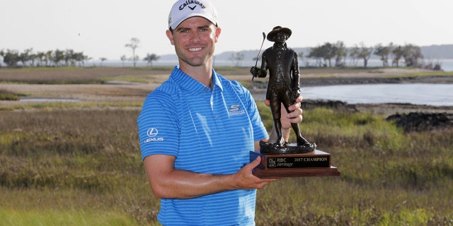 Wesley Bryan celebrates with the trophy after winning the 2017 RBC Heritage at Harbour Town Golf Links during the final round on April 16, 2017 in Hilton Head Island, S.C. (Photo by Streeter Lecka/Getty Images)
