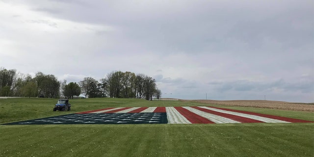 Justin Riggins' massive American flag painting on his property in Indiana. (Credit: Justin Riggins)