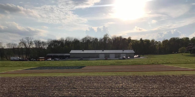 Justin Riggins' massive American flag painting on his property in Indiana. (Credit: Justin Riggins)
