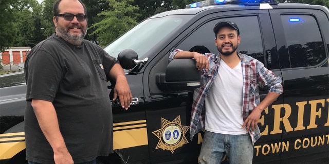 To thank the duo, the sheriff’s office proclaimed them “honest men” and posted a picture of them smiling alongside a patrol vehicle. (Courtesy: Georgetown County Sheriff's Office)